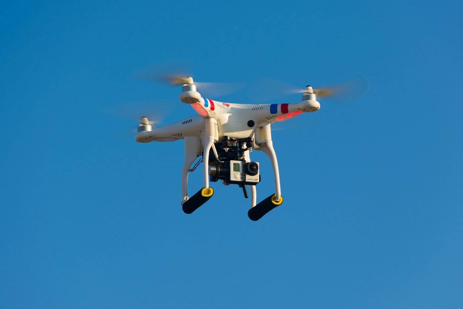 Photo by Will Porada white and red drone